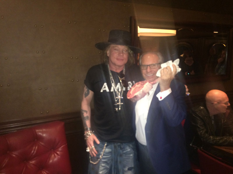 Axel Rose and Greg Sherry holding a Gotham Steak