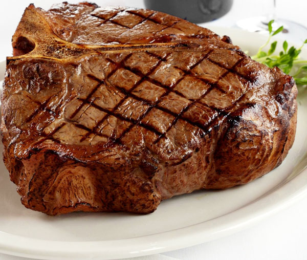 A beautifully seared T Bone steak - best steakhouse nyc