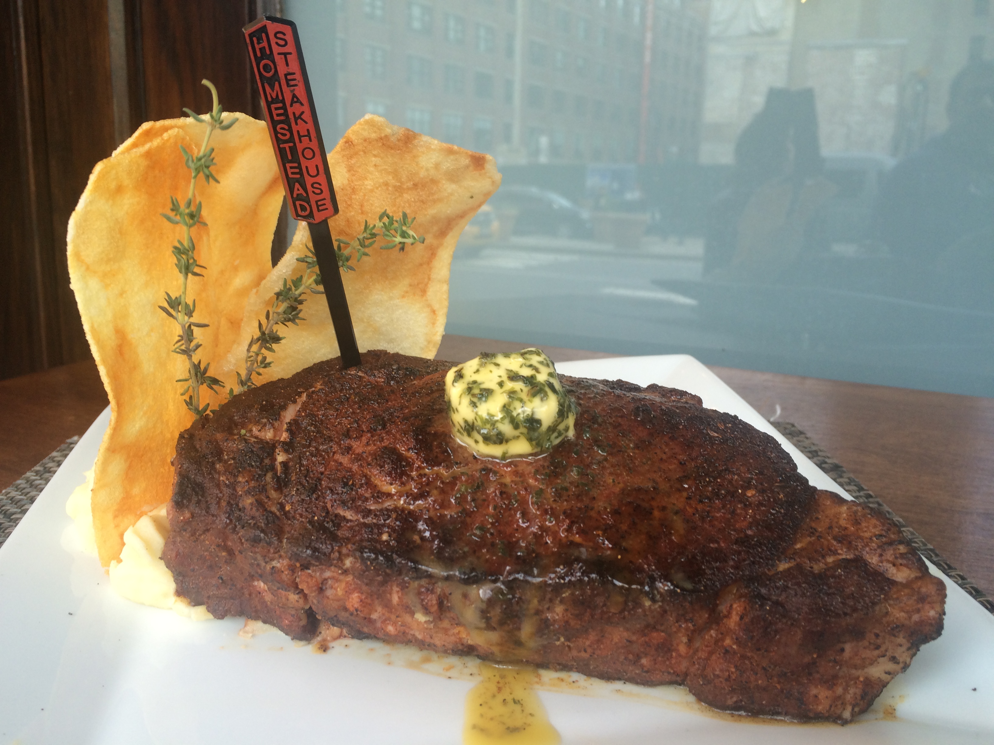 A juicy steak topped with herb butter