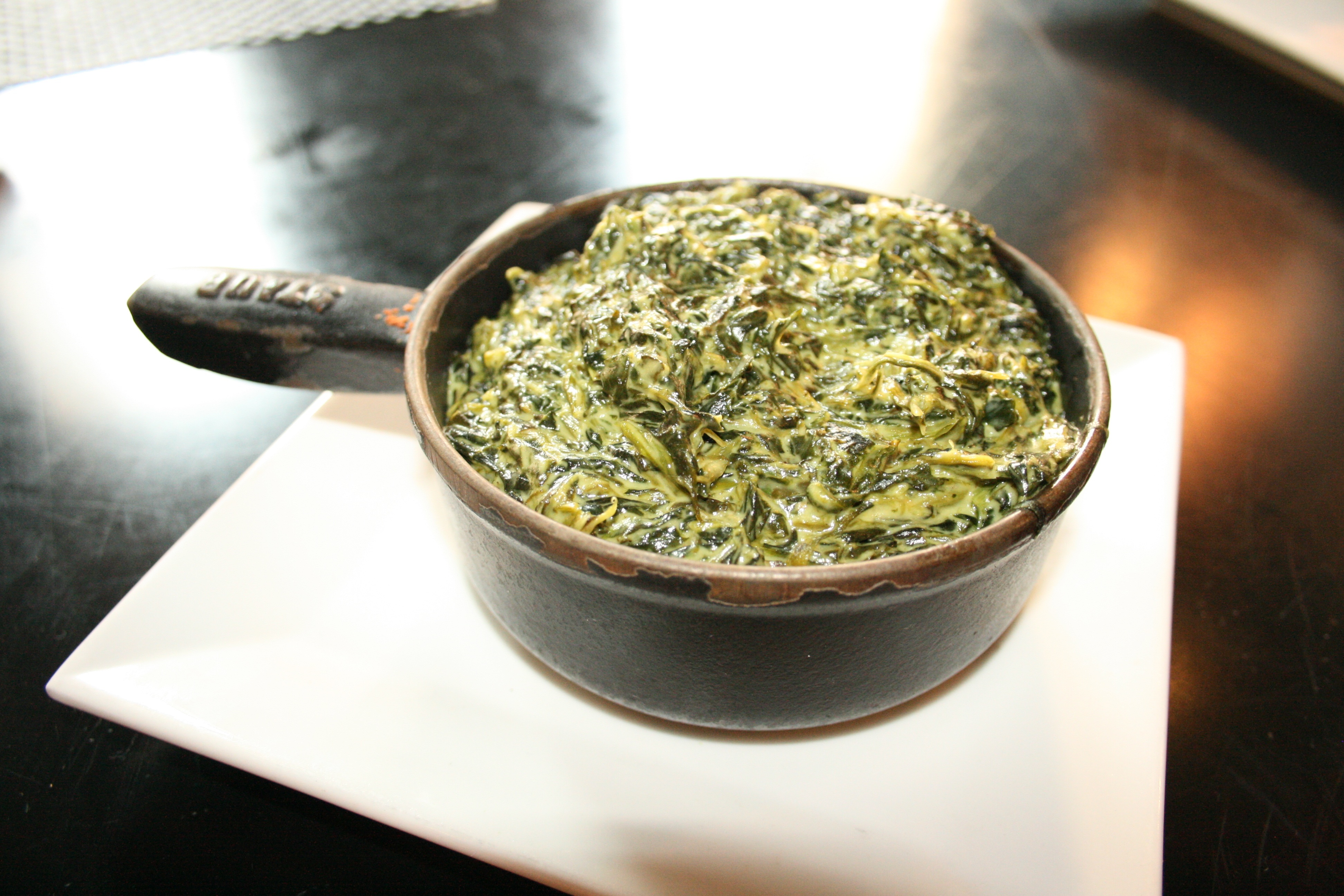 A bowl of creamed spinach